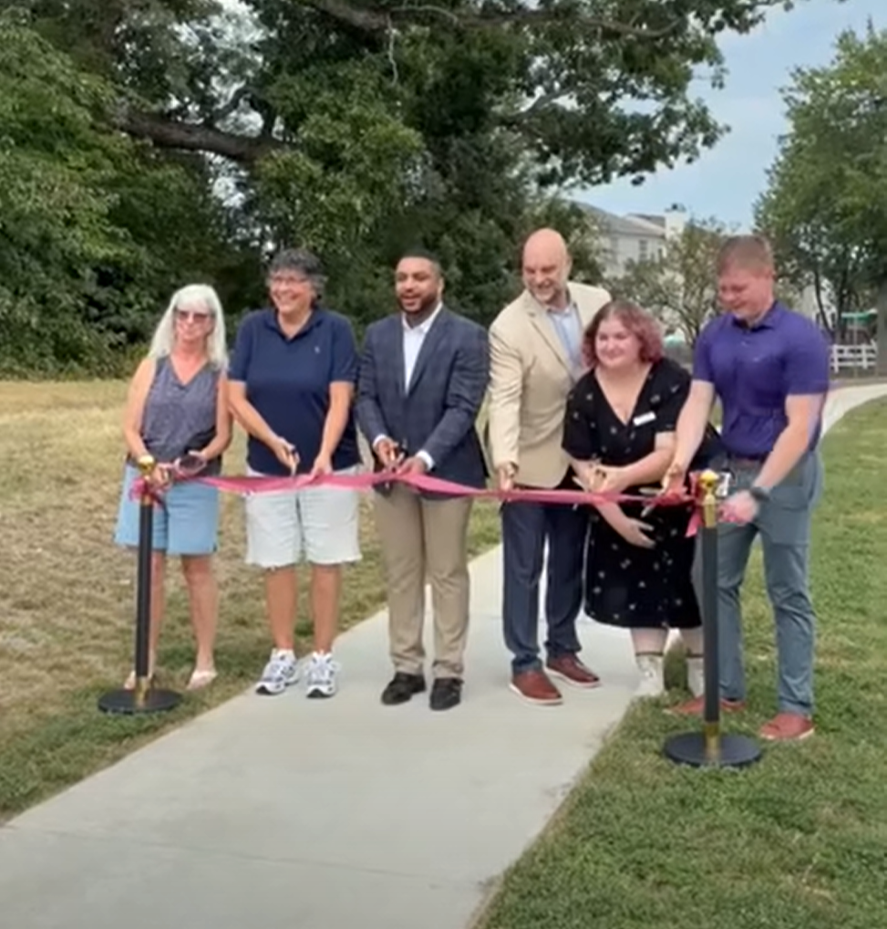 Community representatives and Stafford County officials cutting the ribbon on the Staffordboro Boulevard sidewalk